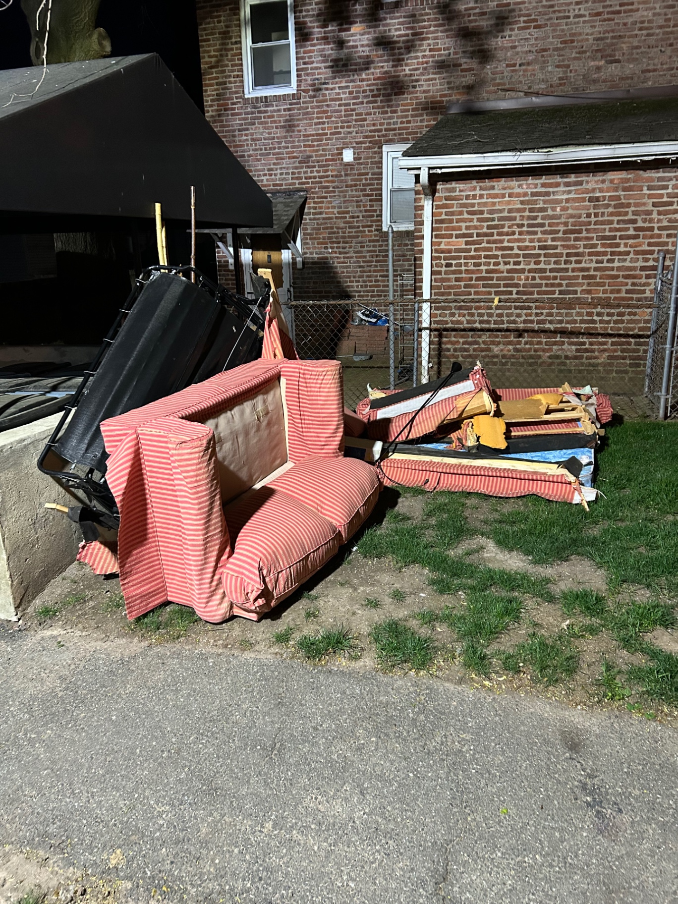 Curbside couch and furniture pile removed in Wayne, NJ — before