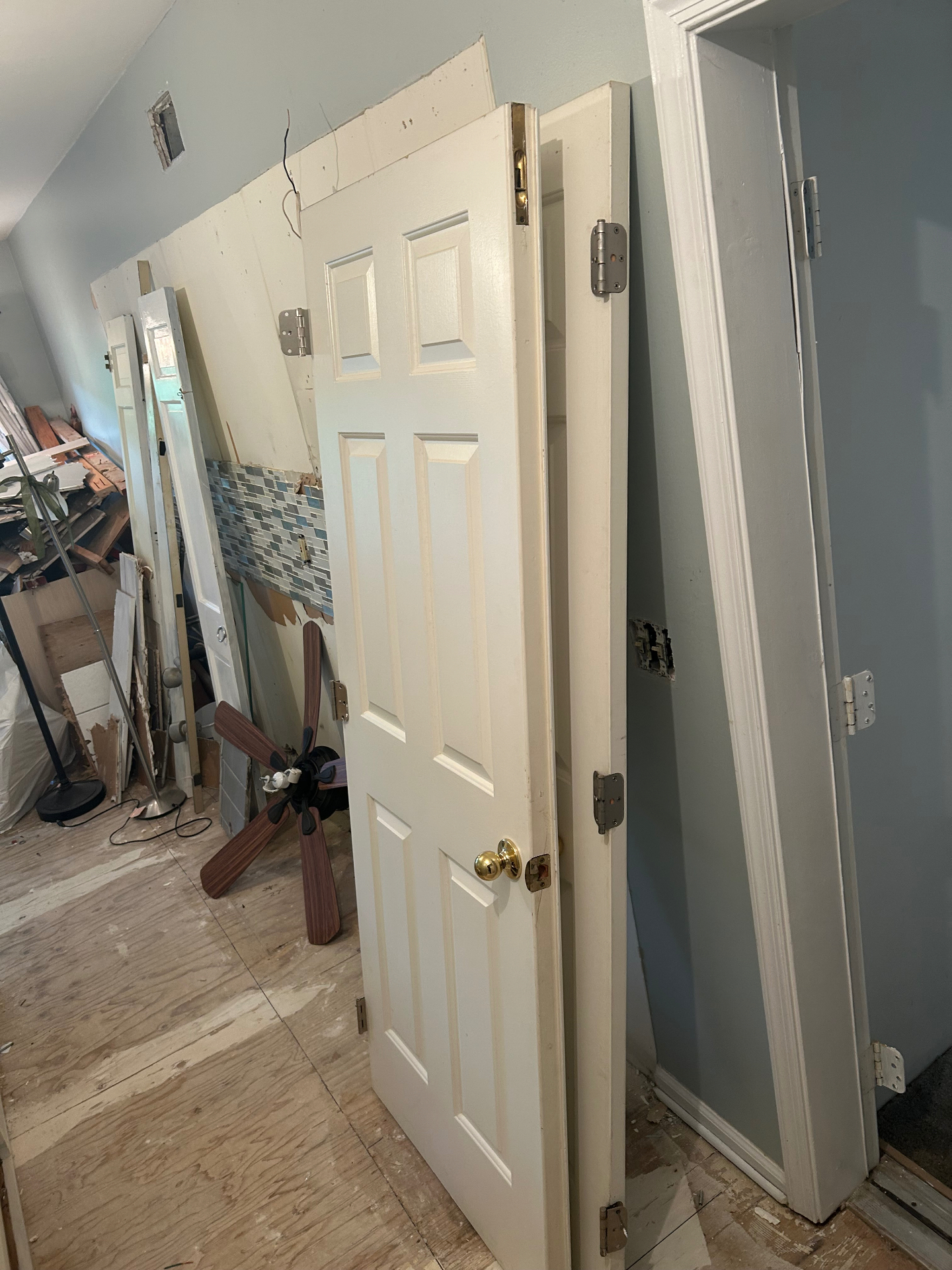 Interior demolition cleanup with doors, debris, and bulky materials removed in New Jersey — before