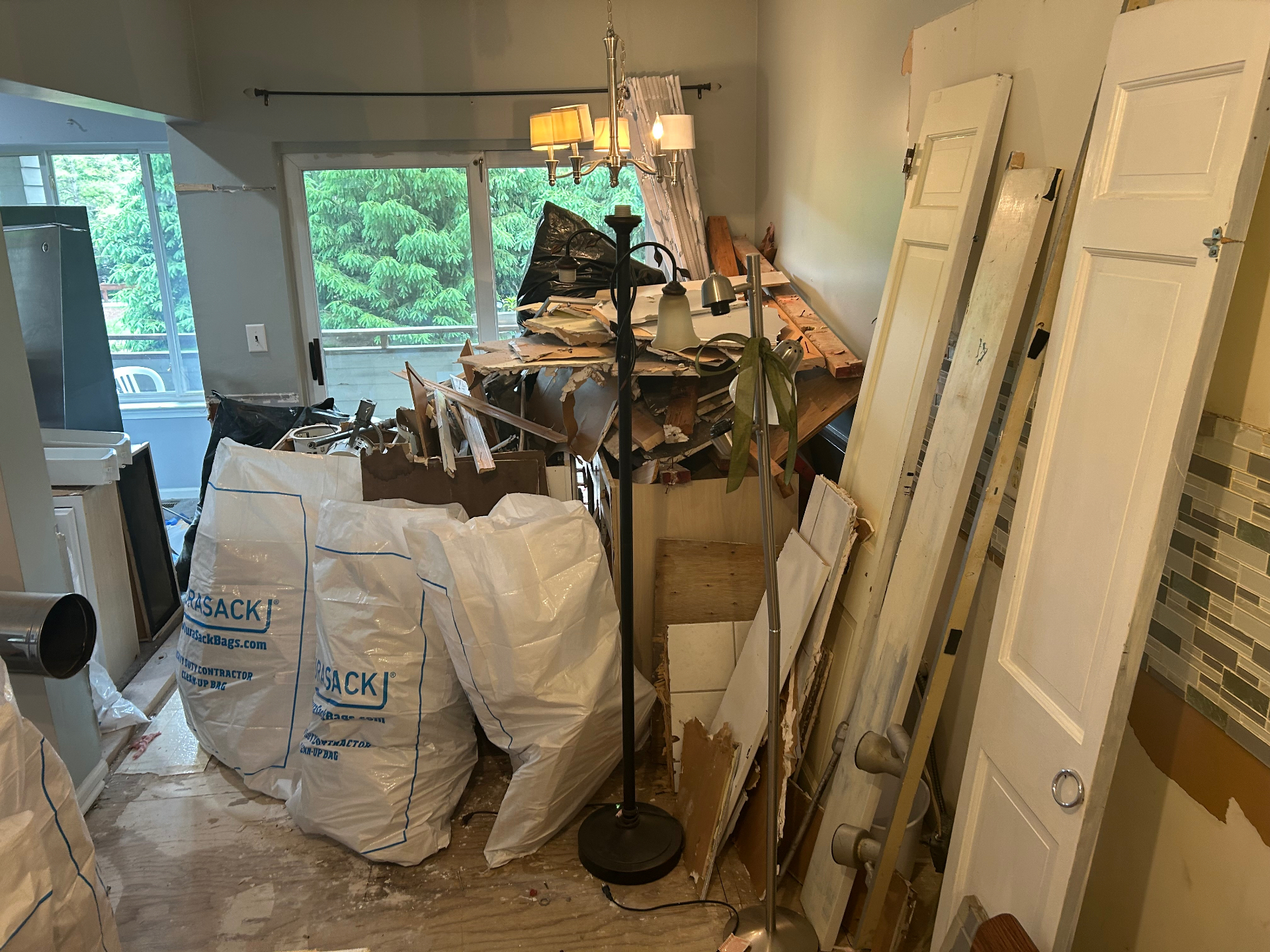 Large interior demo debris haul-away with room fully cleared in New Jersey — before