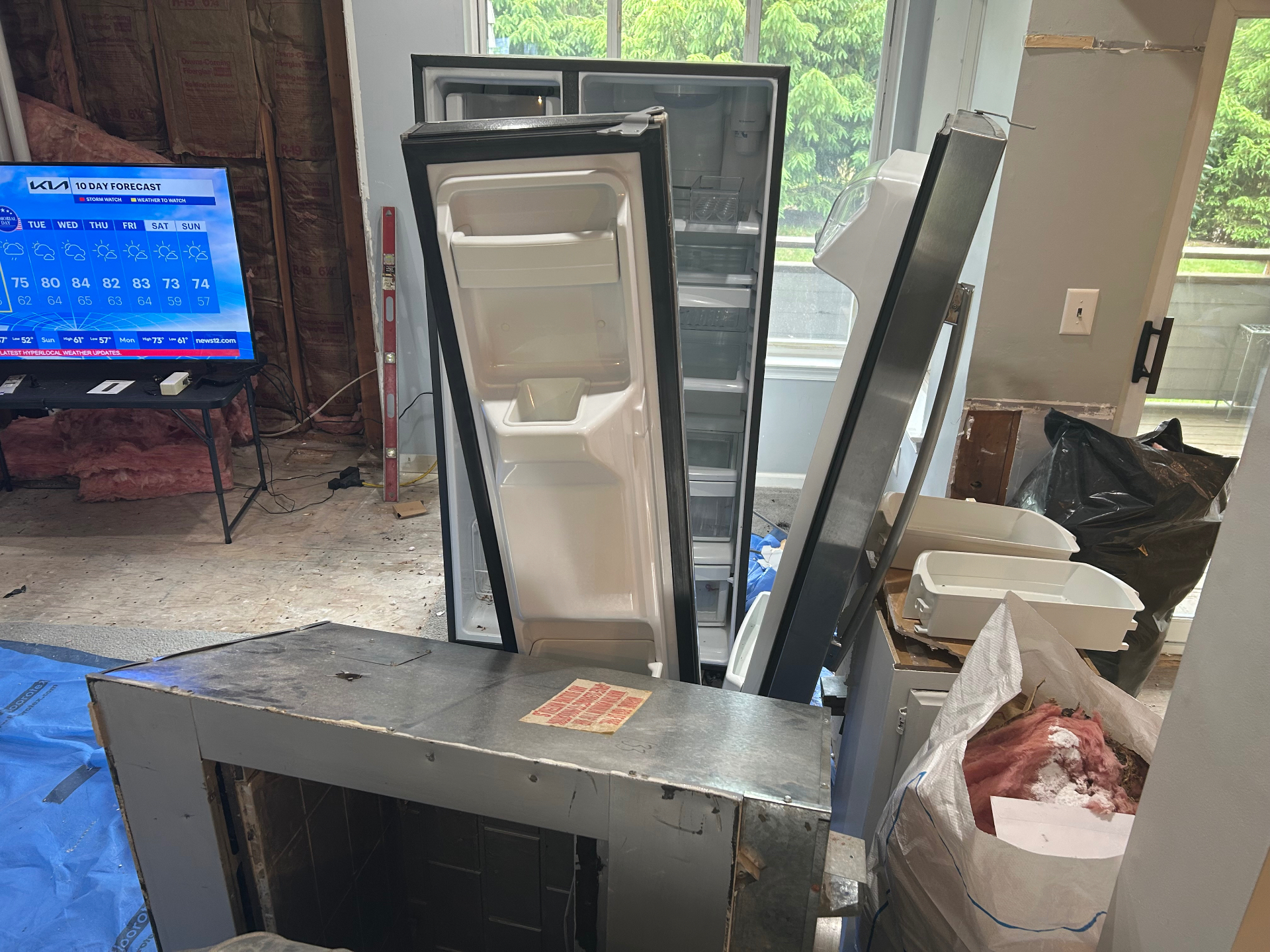 Old refrigerator and appliance removal with kitchen space cleared in New Jersey — before